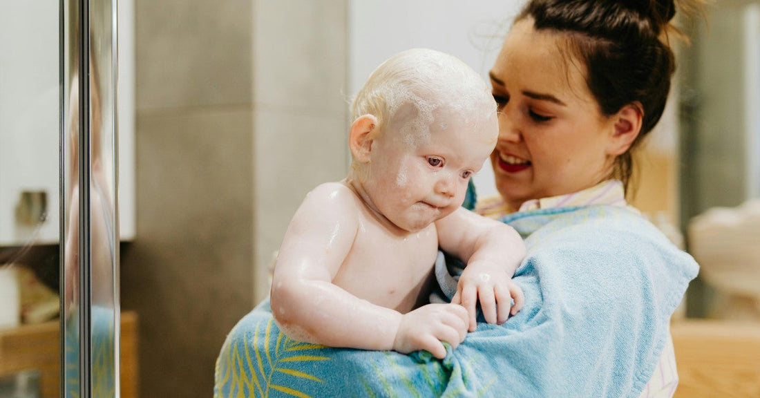 new mum carrying baby