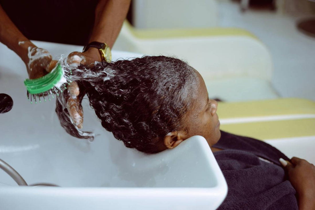 black lady getting hair washed